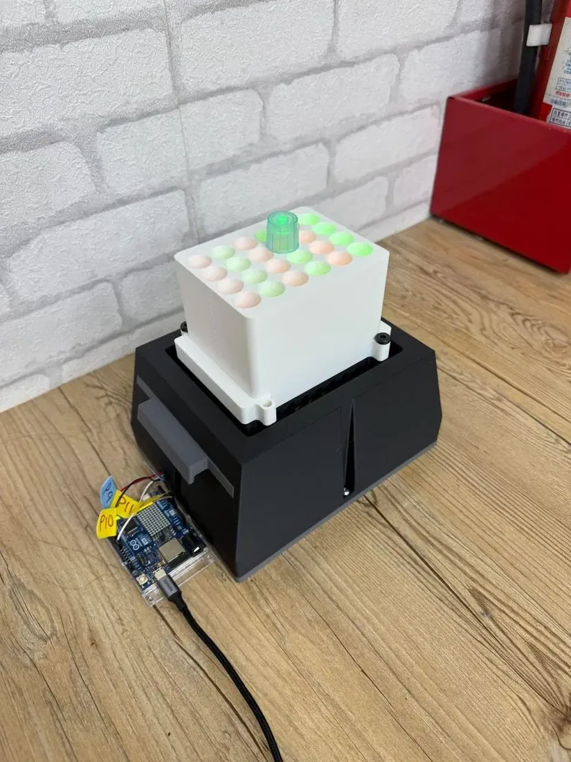 Iteration 3: a white tube block seated on a black electronics base, an Arduino board beside it.