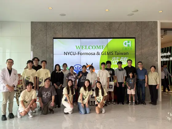 The group posed in front of a welcome screen.