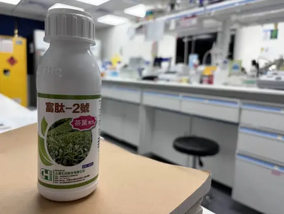 A bottle of CH Biotech protectant on a lab bench.