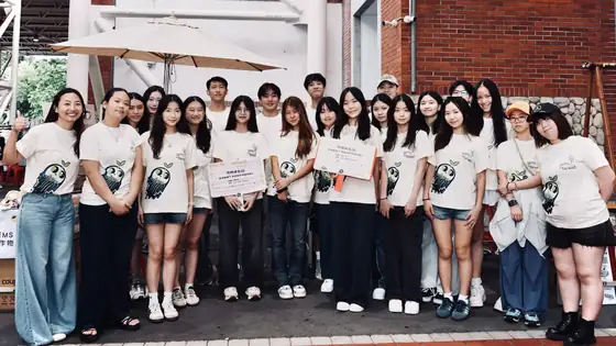 The team posed together at the market.