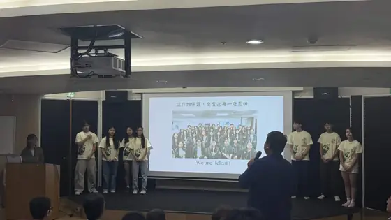 Team members on stage during the forum.
