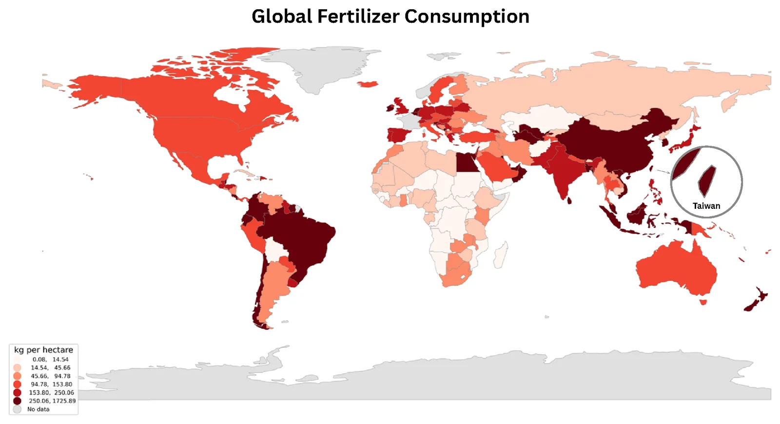 World choropleth of fertilizer consumption in kilograms per hectare, pale pink to near-black, with an inset circle enlarging Taiwan in the darkest class alongside China, Japan and Malaysia.