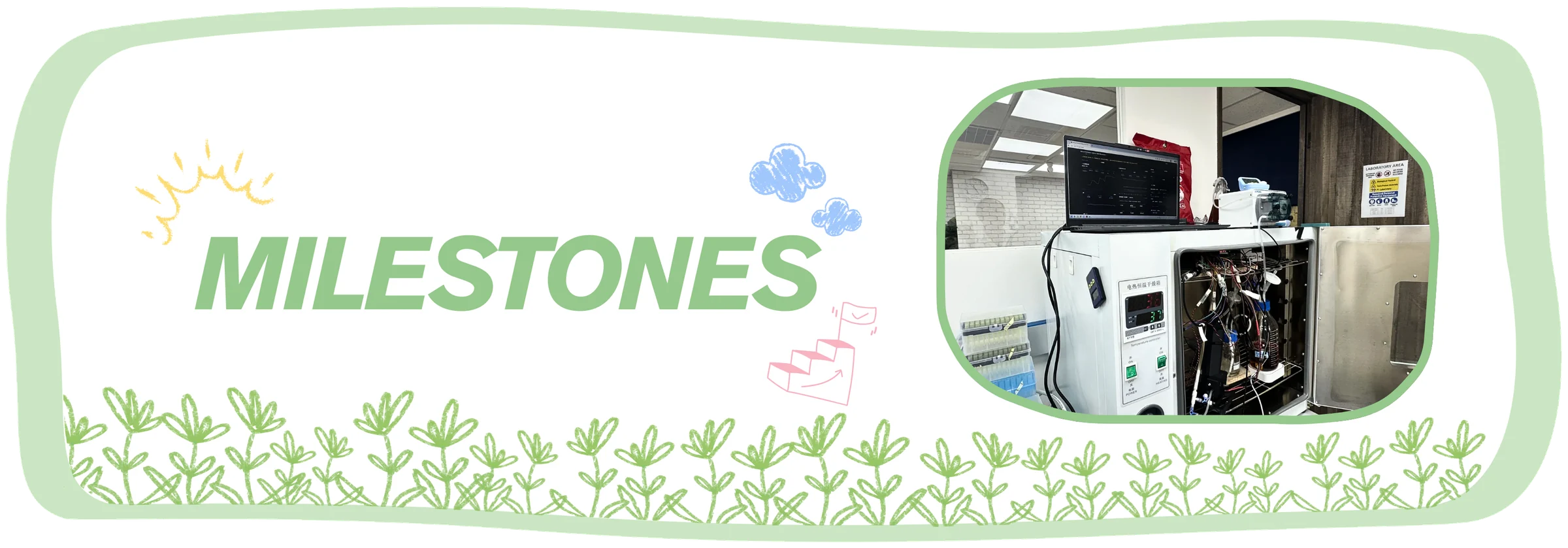Milestones. The bioreactor stands open on a bench with its wiring showing, a laptop on top running the dashboard.