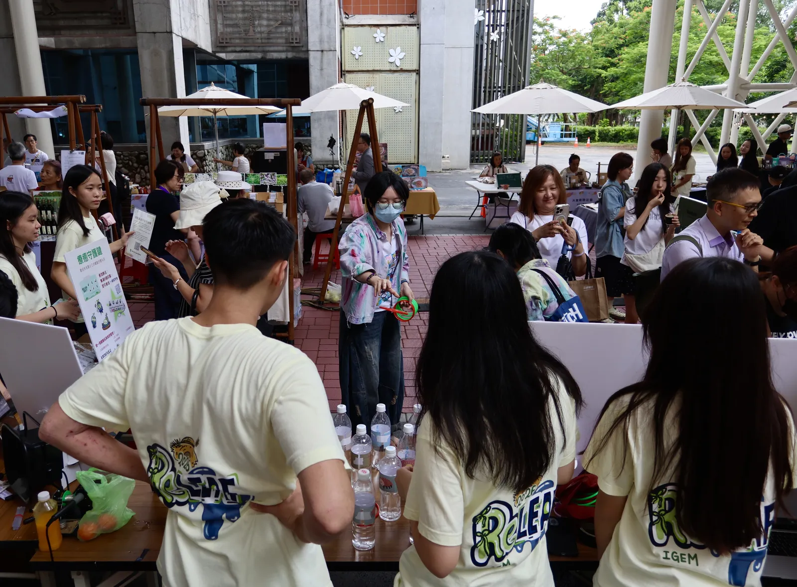 Children playing ring toss at the booth.