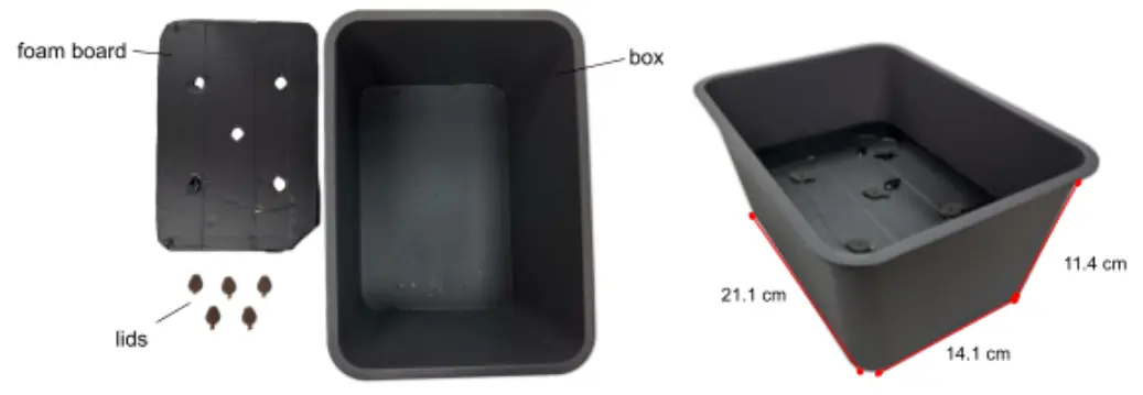 The first container: a large black plastic tank, 21.1 by 14.1 by 11.4 cm, beside its hand-cut foam board with five holes, taped black, and five seed-holder lids.