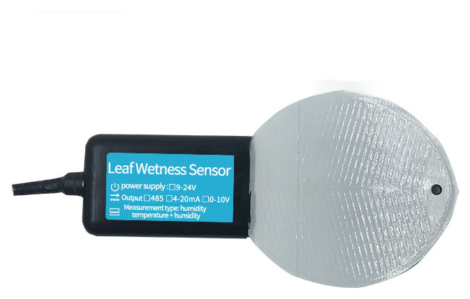 A leaf wetness sensor: a black housing with a blue label reading Leaf Wetness Sensor, a cable on one side and a pale leaf-shaped sensing plate on the other.