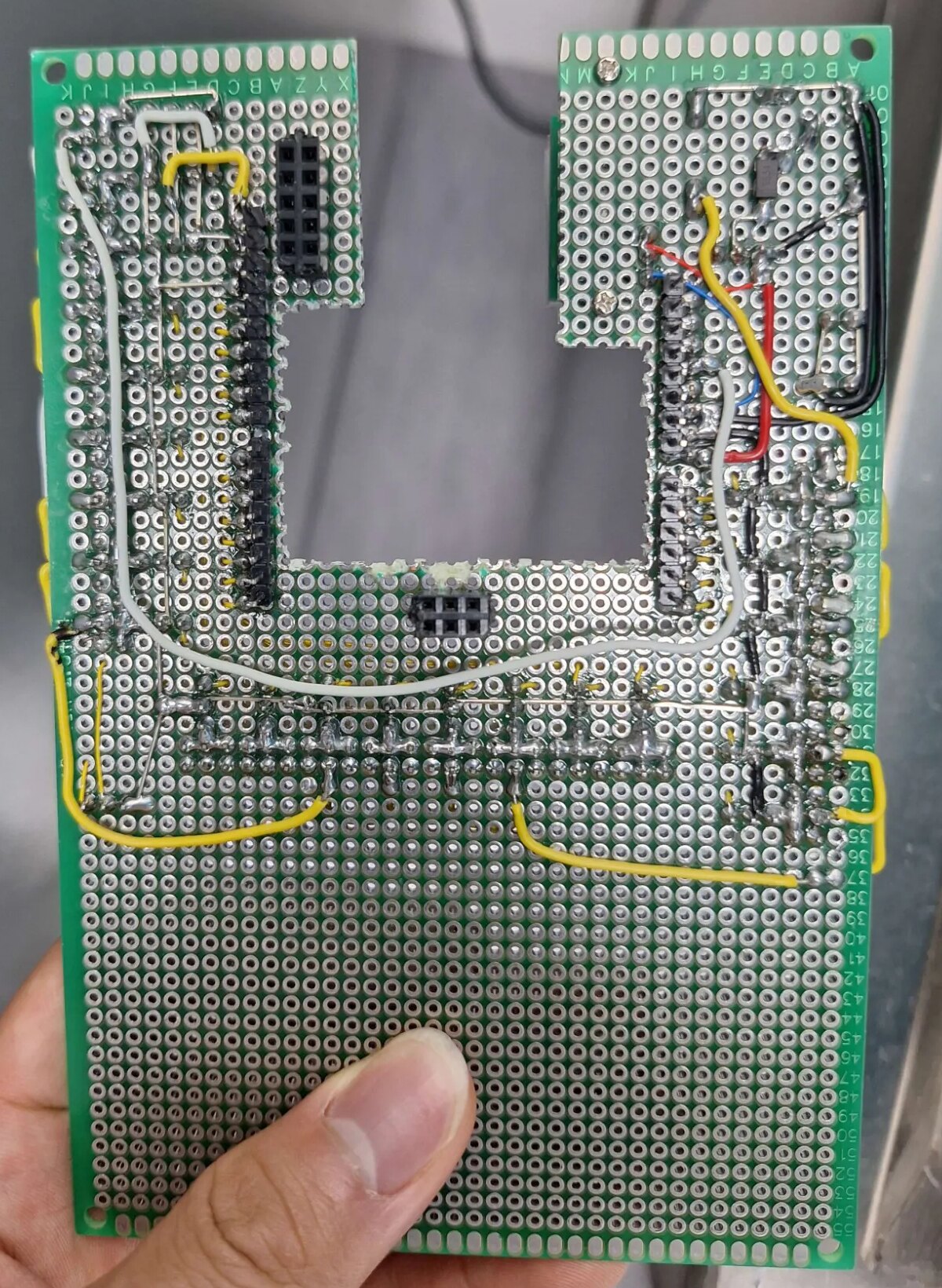 Solder side of the breakout board showing the female headers, jumper wires and the diode